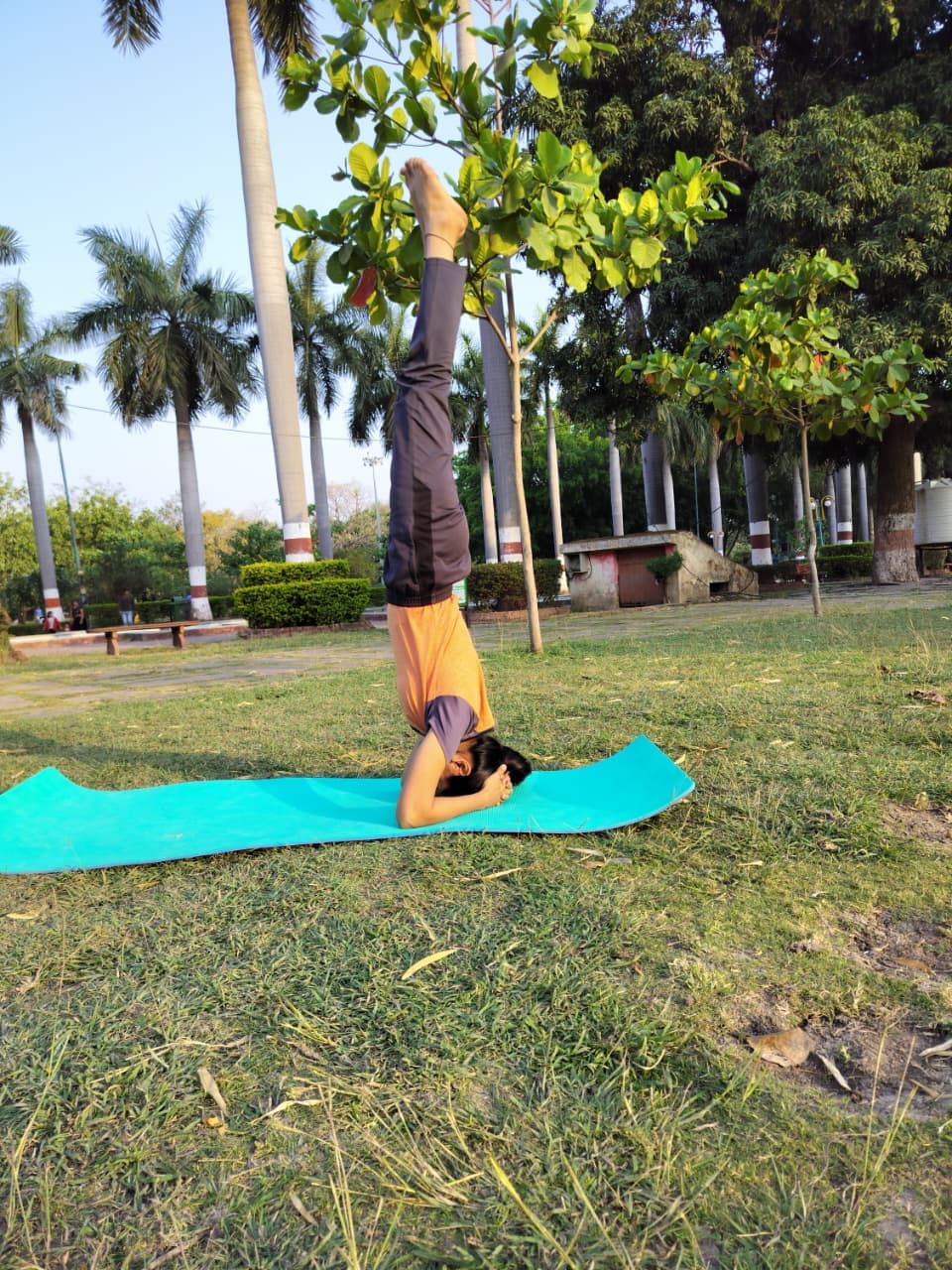 Arti demonstrating a yoga pose
